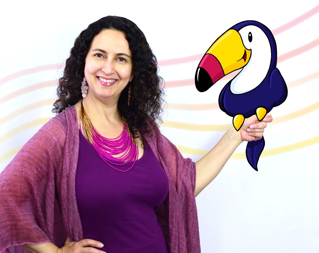 Piano teacher dressed in a mauve outfit and big jewelry stands in front of a wavy  rainbow music staff while holding a smiling cartoon toucan in her left hand.