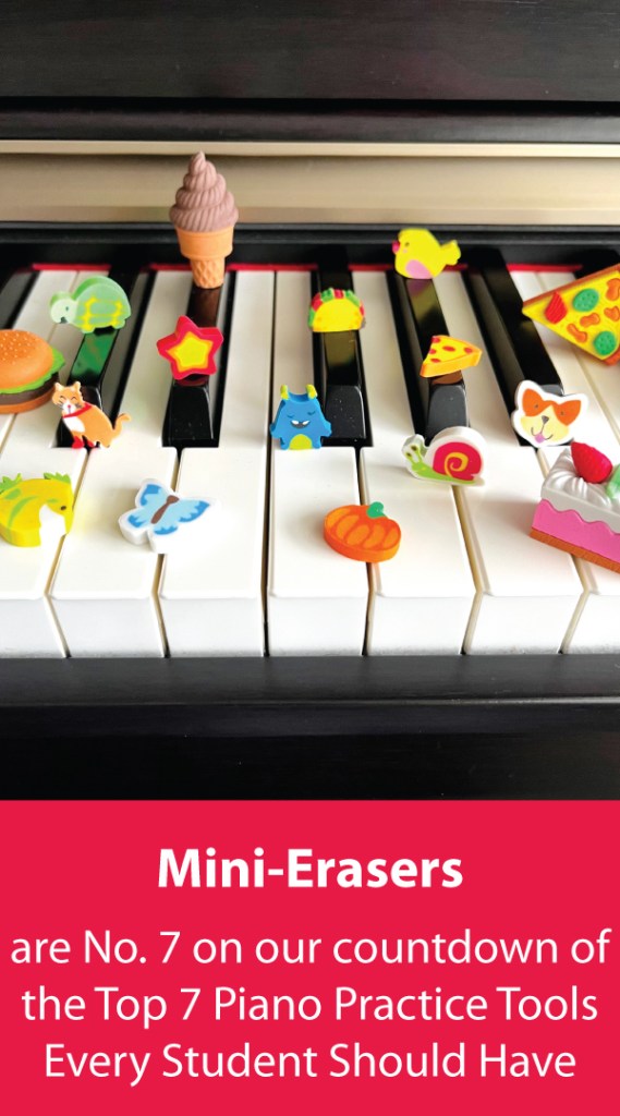 A variety of mini-erasers sit on top of the keys of a piano.