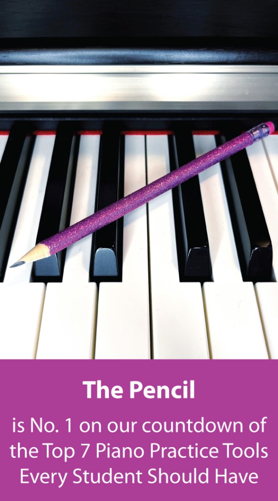 A glittery pink pencil sits on the keys of a piano.