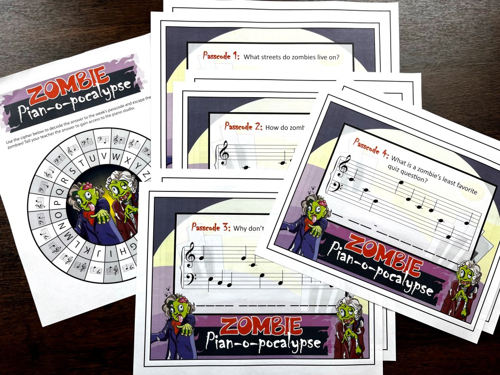 The Zombie piano apocalypse passcode  which are a series of zombie jokes are spread out on a wood table along with the cipher wheel.