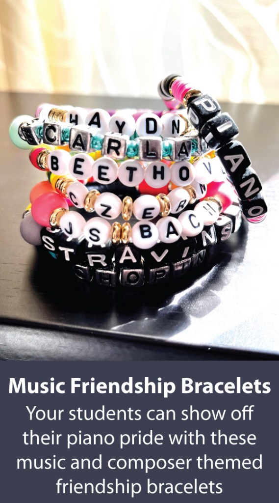 Music-themed friendship bracelets sit in a pile on top of a piano